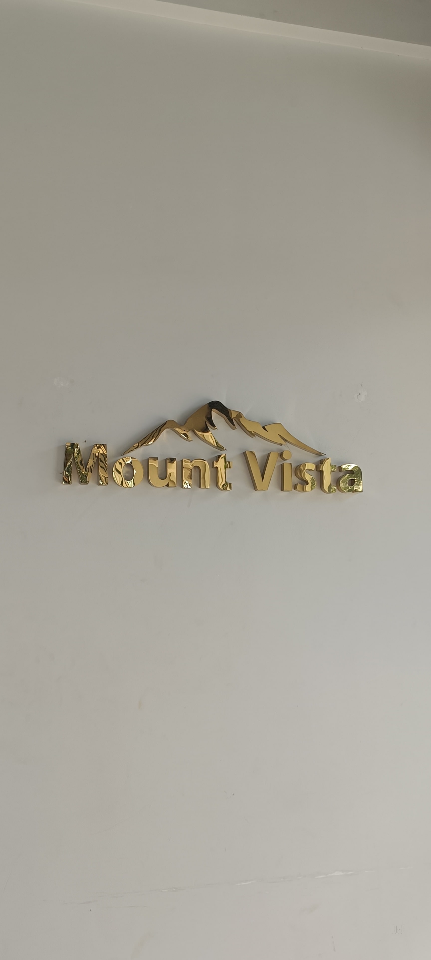 Golden Mount Vista Signage on White Wall